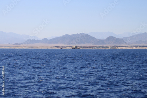 Red sea, Egypt, blue water, broken ship, sky © Igor