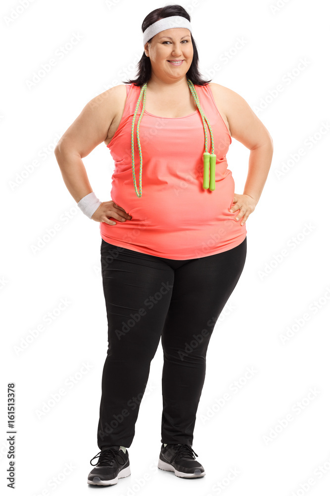 Full length portrait of an overweight woman with skipping rope Full length portrait of an overweight woman with skipping rope