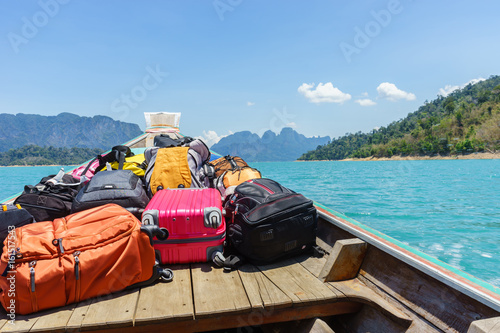 luggage on transport boat go to island