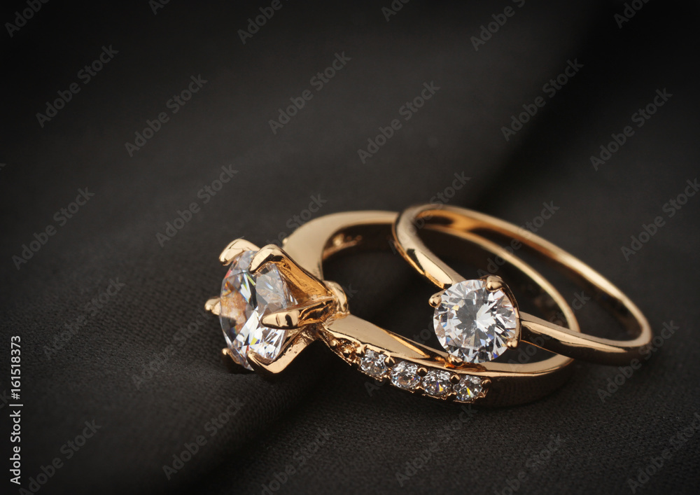 jewelry rings with diamond on black cloth, soft focus - obrazy, fototapety, plakaty 