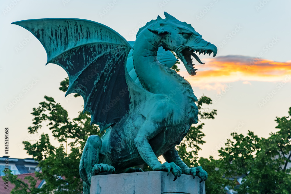 Green dragon breathing fire on Dragon bridge in Ljubljana
