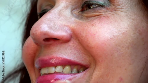 graded shot of old woman with very soft skin  spreading beauty cream on her face