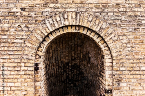 old ancient brick wall vault tunnel grunge background