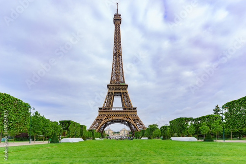 The famous Eiffel Tower in the cloudy day , Paris , France
