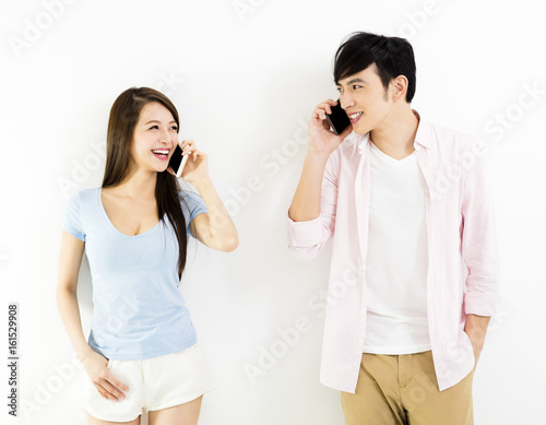 happy young couple talking on the phone