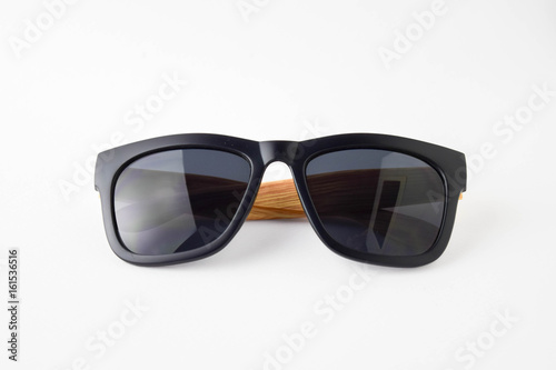 back sun glassess wooden legs on white background