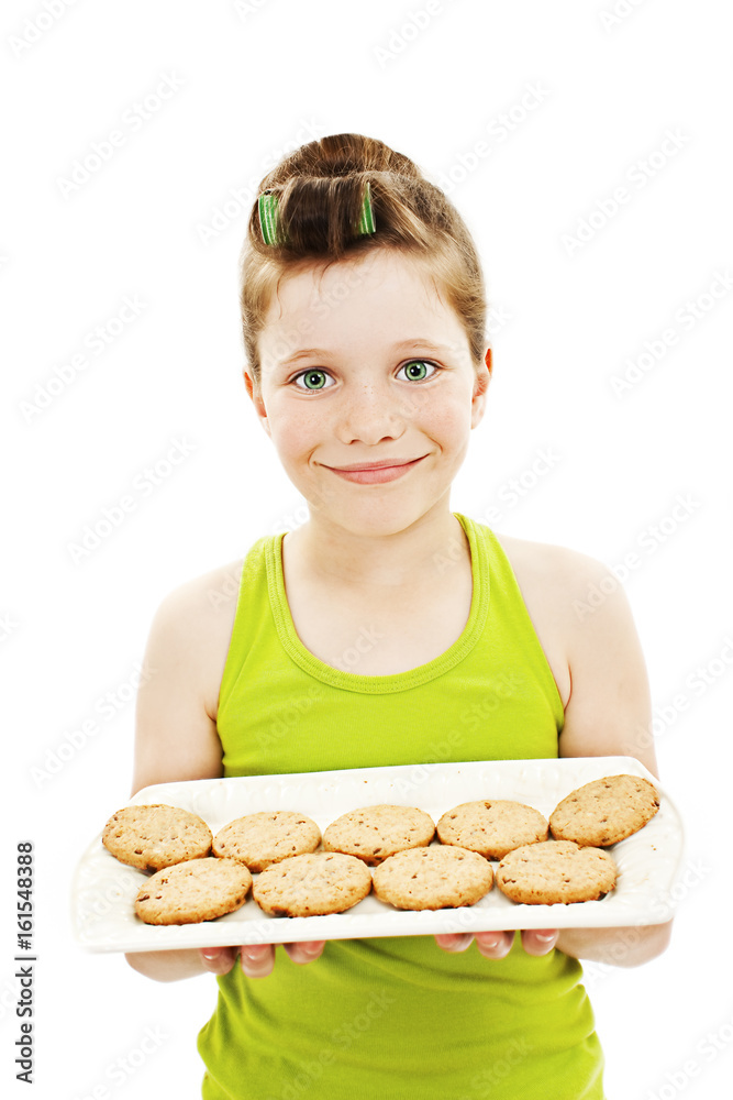 Little housewife showing cookies on tray. Isolated on white background. Little housewife showing cookies on tray. Isolated on white background.