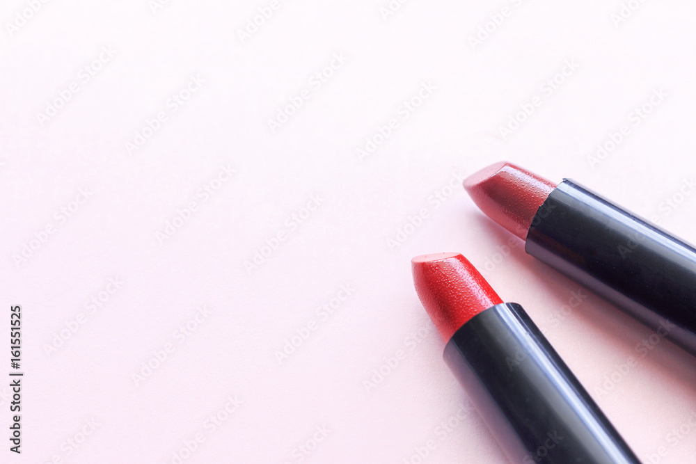 closeup lipstick on pink background. over light and sooft-focus closeup lipstick on pink background. over light and sooft-focus