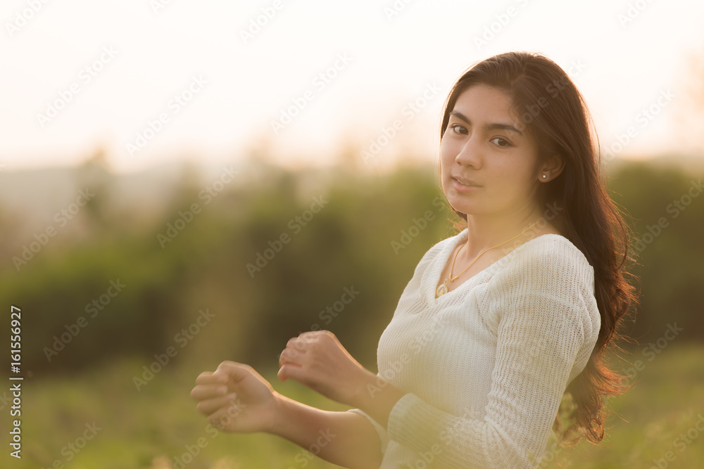 Asian girl in the flowers garden Asian girl in the flowers garden