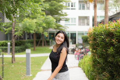 Asian woman walking on the park Free Download Asian woman walking on the park - GFXLoad