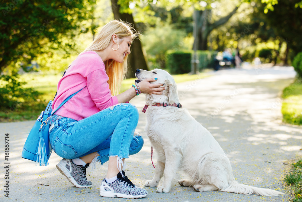 Woman enjoying park with dog Woman enjoying park with dog