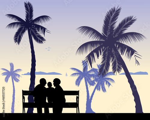 Grandmother and grandfather siting with grandchild on the beach, one in the series of similar images silhouette