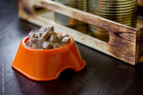 Canned pet food in a orange...