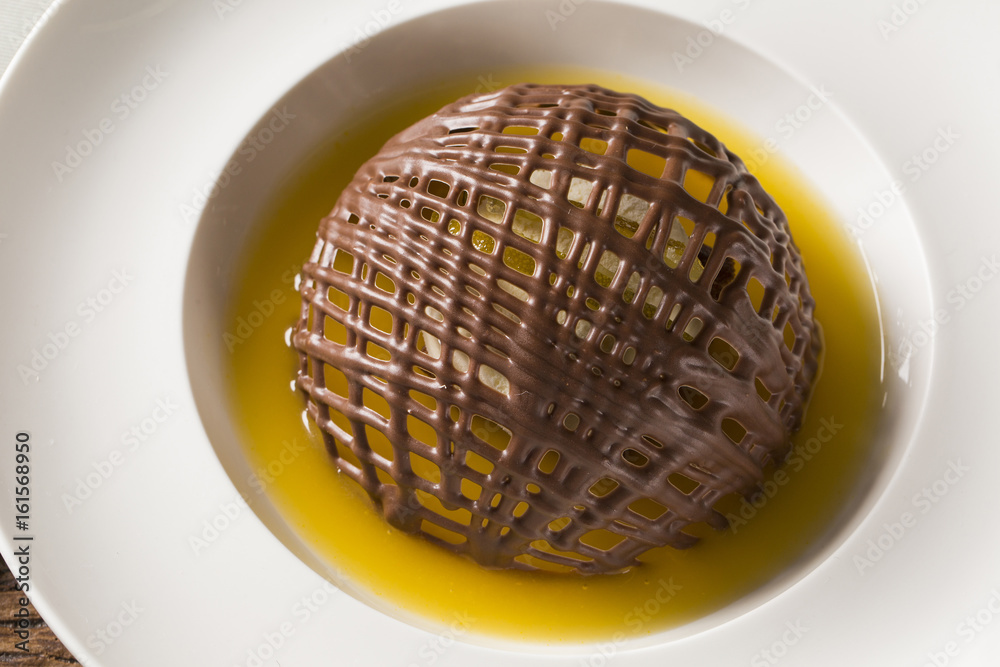 Chocolate cookie with ice cream and orange sauce Chocolate cookie with ice cream and orange sauce