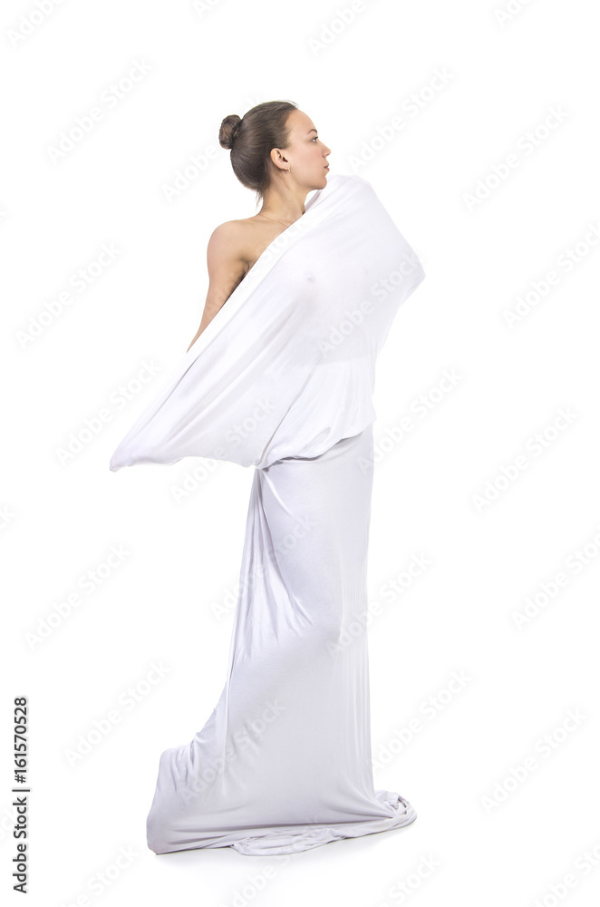 A young,smiling girl in white conceptual dress . A young,smiling girl in white conceptual dress .