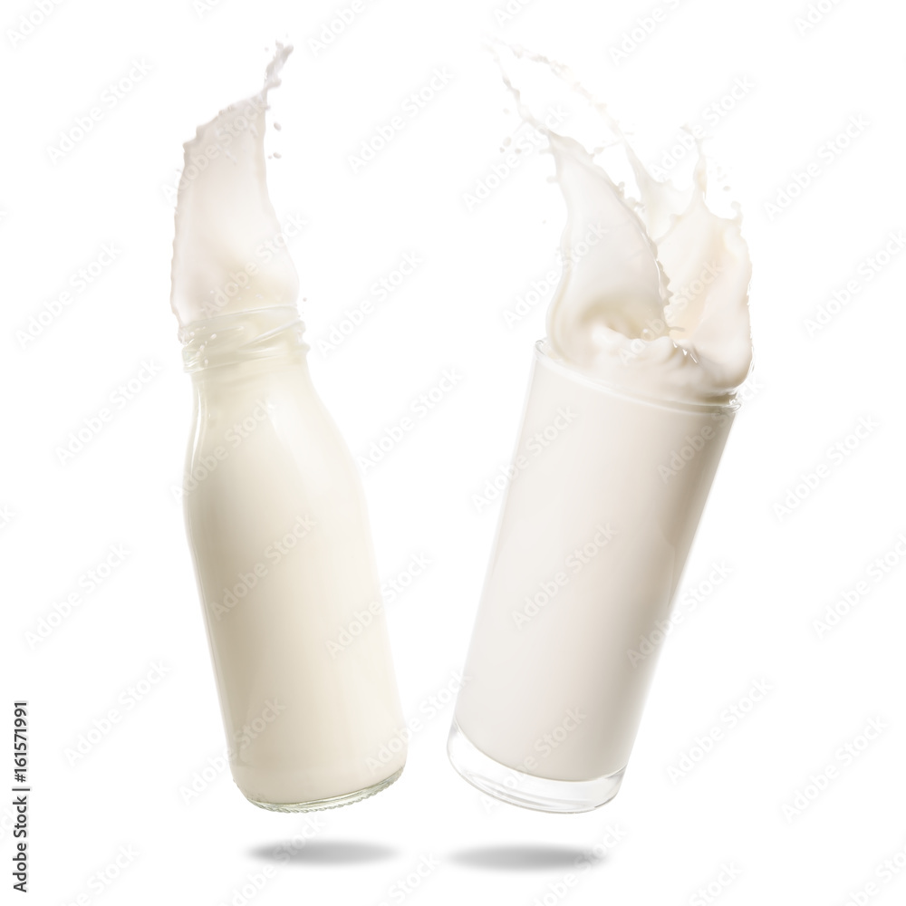 Milk splash out of bottle and glass isolated on white background. Milk splash out of bottle and glass isolated on white background.