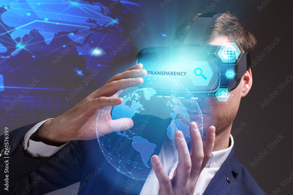 Business, Technology, Internet and network concept. Young businessman working on a virtual screen of the future and sees the inscription: Transparency Business, Technology, Internet and network concept. Young businessman working on a virtual screen of the future and sees the inscription: Transparency
