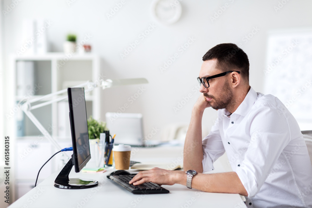 businessman typing on computer keyboard at office businessman typing on computer keyboard at office