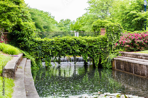 Carroll Creek in Frederick, Maryland city park with canal and flowers on bridge in summer photo