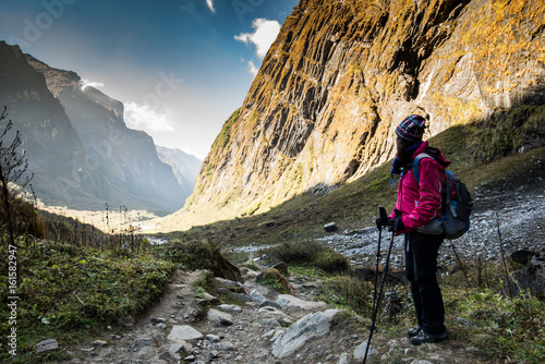 The traveler's walking on the way to Annapurna base camp