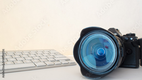 camera and keyboard on white background