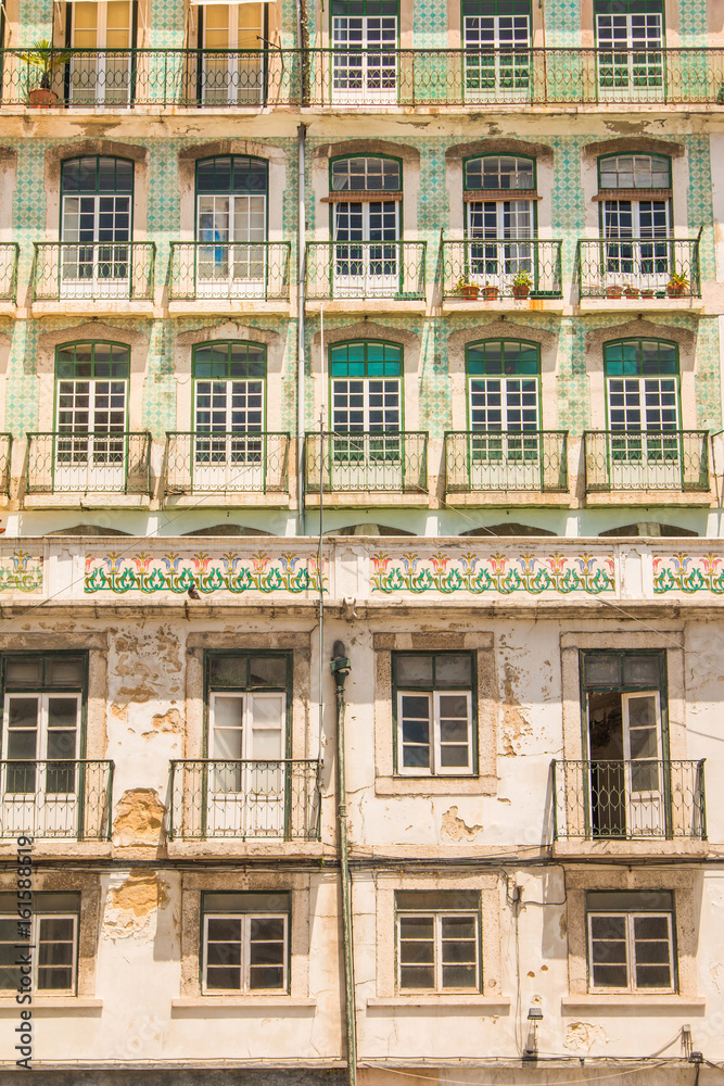     Typical colorful rusty facades wall on houses in Lisbon, Portugal 