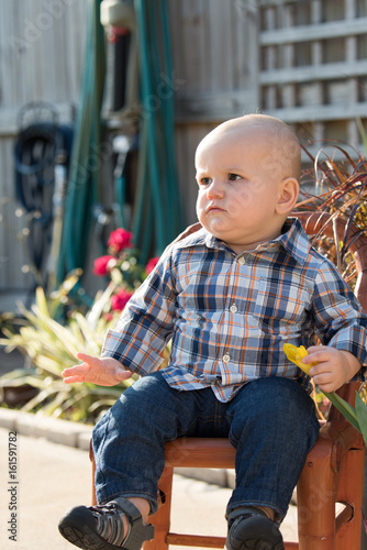 Baby Boy Sitting on Garden Chair