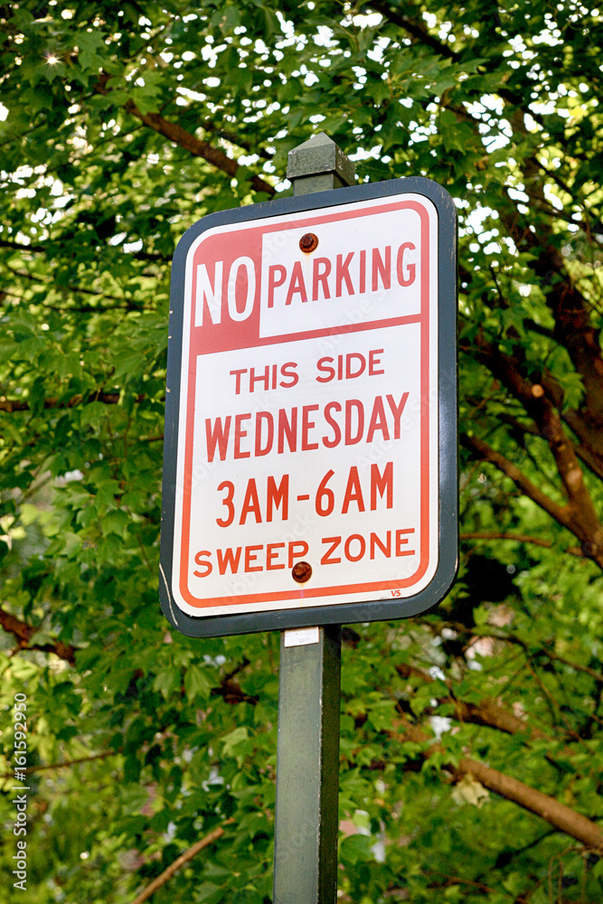 No Parking - This Side Wendesday 3am-6am Sweep Zone sign
