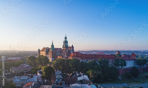 Krakow, Poland. Skyline panorama with historic royal Wawel castle and cathedral. Aerial view in sunrise light