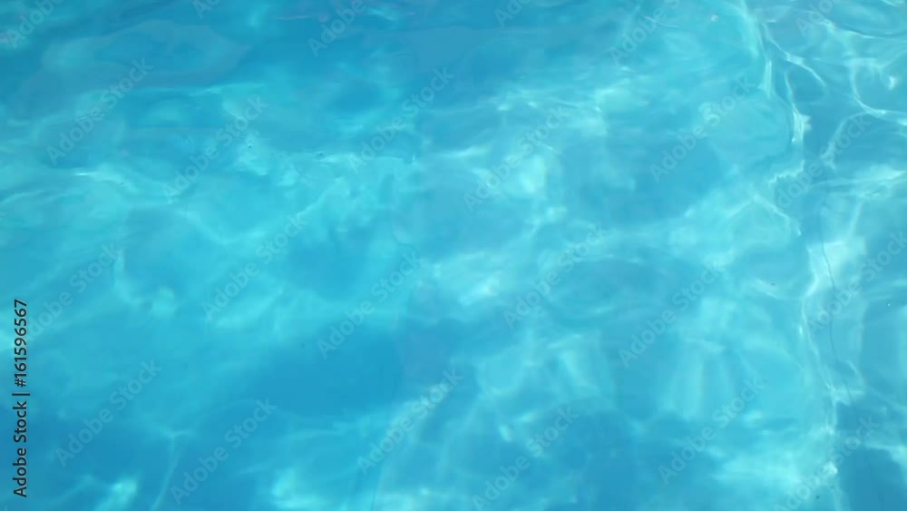 Girl swims under the water in the pool Girl swims under the water in the pool