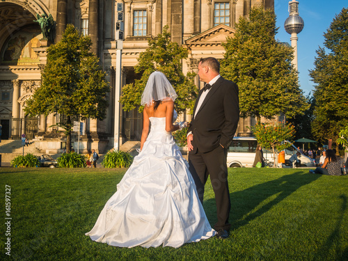 Multicultural newlywed couple turned back at Berliner Dom in Berlin, Germany
