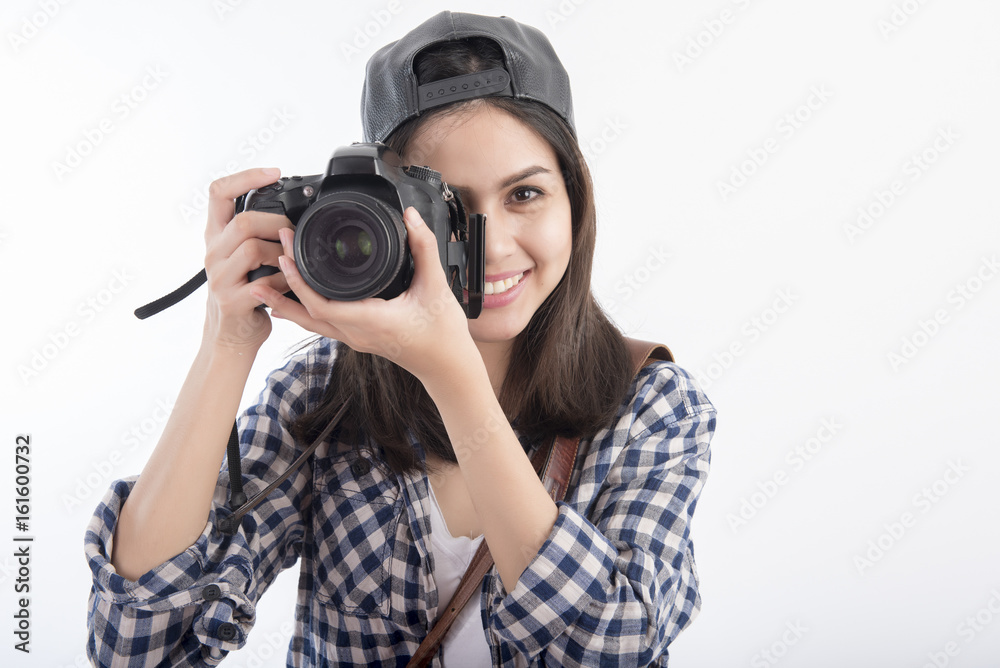 Beautiful travel girl with camera isolated on white background Beautiful travel girl with camera isolated on white background