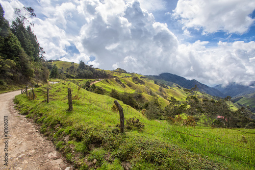 Dramatic afternoon rain clouds gather on a rural mountain top outside of Salento, Colombia.