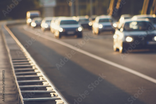 Cars driving on bridge road defocused image