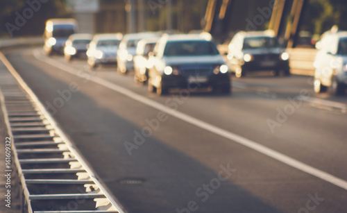 Defocused image of cars driving on bridge road