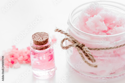 homemade spa with rose cosmetic set, cream and oil on white background