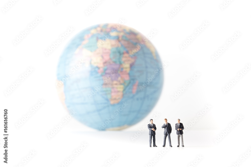 miniature model of businessman standing together and the world background, investor concept, isolated on white background. miniature model of businessman standing together and the world background, investor concept, isolated on white background.