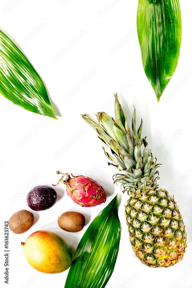 Exotic fruits dragonfruit, mangosteen, mango, kiwi and lime on white background top view copyspace Exotic fruits dragonfruit, mangosteen, mango, kiwi and lime on white background top view copyspace