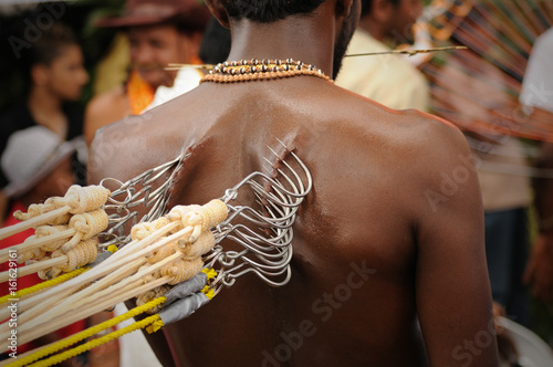 tamil man at thaipusam festival photo