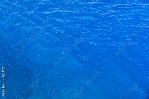 Natural background of blue sea water.