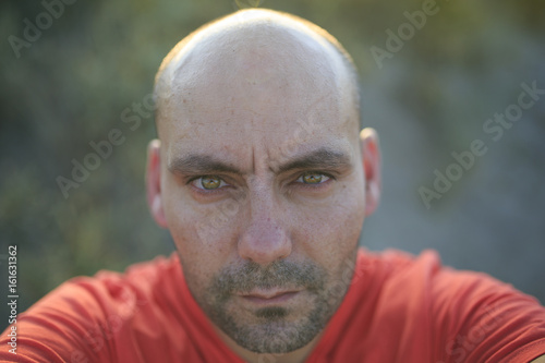 Green eyes man auto portrait