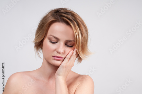 Closeup of woman suffering from toothache