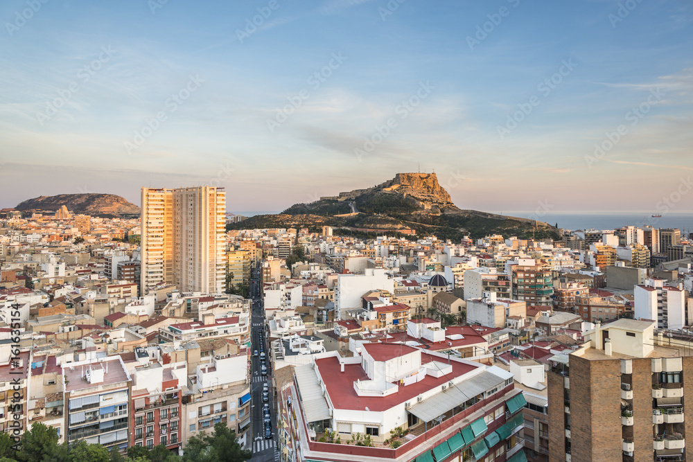 View of Alicante city center and Santa Barbara castle at the sunset, Spain