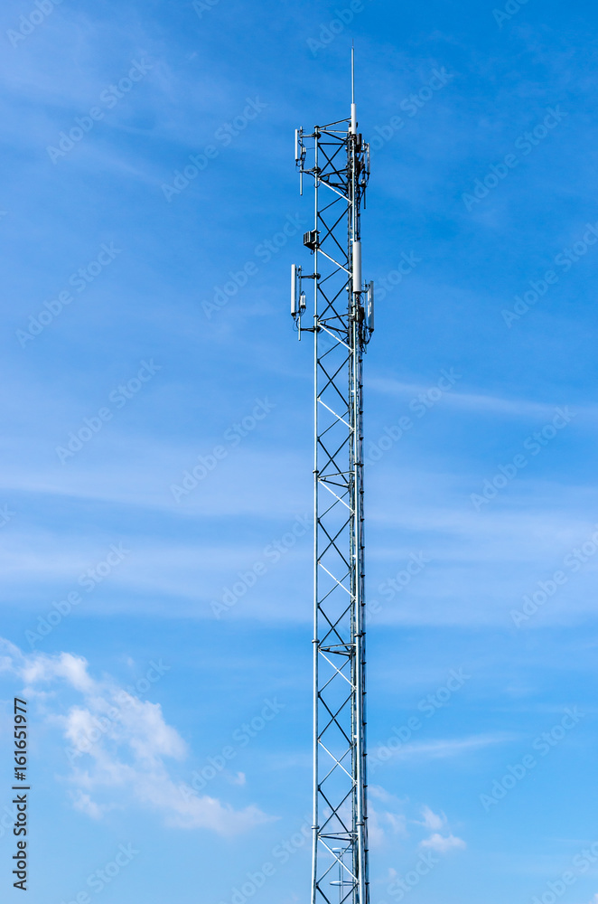 Cell phone antenna with blue sky background Cell phone antenna with blue sky background