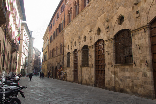 Typical street of Siena, Tuscany, Italy.