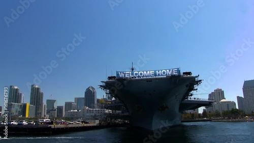 Float by Aircraft Carrier in City Bay