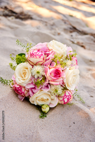 a bouquet of flowers on beach