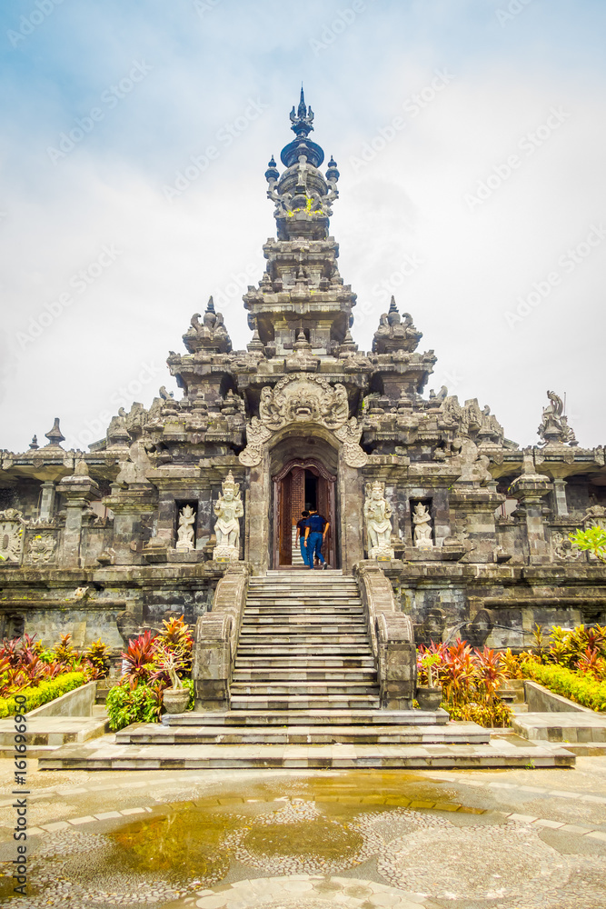 BALI, INDONESIA - MARCH 08, 2017: Panoramic landscape traditional balinese hindu temple Bajra Sandhi monument in Denpasar, Bali, Indonesia on background tropical nature and blue summer sky, Indonesia