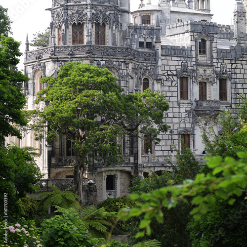 Quinta da Regaleira palace in Sintra, Portugal. gothic building in trees