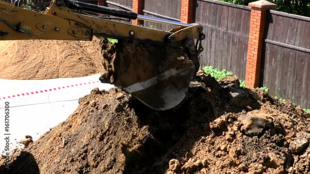 Bucket excavator Tractor digging a hole. Construction earthmoving ...